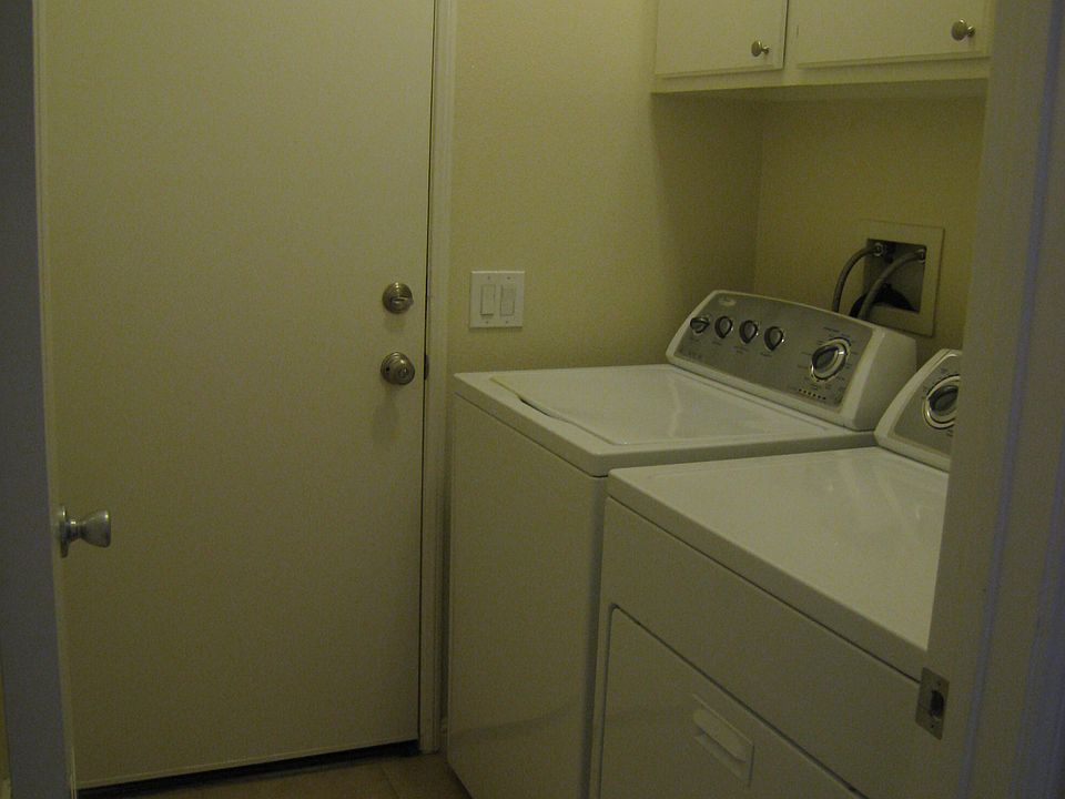 Laundry room next to garage