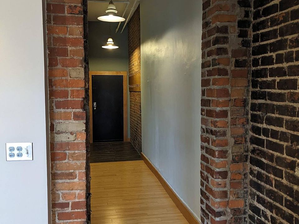 Exposed brick and hardwood floors.
