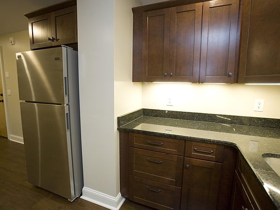 Kitchen with stainless steel Energy Star appliances, granite countertops, and cherry cabinets