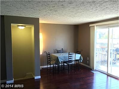 Dining area off living room with natural light