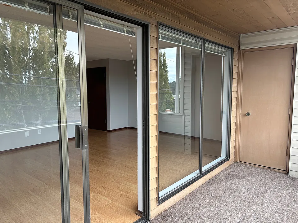 Large living room as seen from balcony. Note there is a storage closet on the balcony.