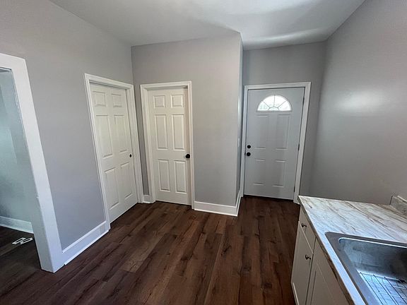 View from oven towards Front door, bedroom, bathroom, and living room