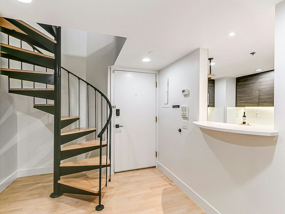 Entrance with spiral stair case to go up to Primary Suite