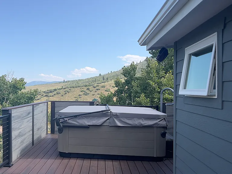 Hot Tub off Master bedroom, with private entry, also a stair case to to back yard.