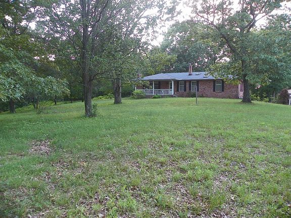 House is set back well off the paved Highway.