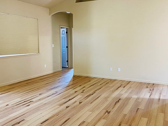 Living room with door to primary room