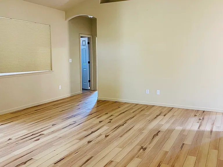 Living room with door to primary room