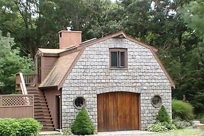 Stone Carriage house with 3 room apartment above.
