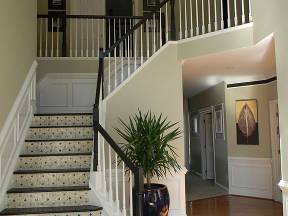 Foyer with Onyx and Blue Glass Staircase
