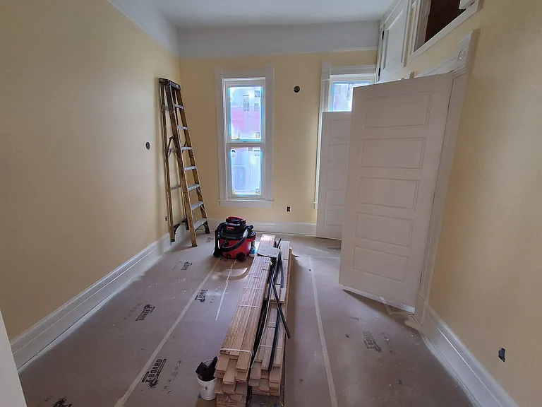 Friendly yellow middle bedroom as of July 22.
