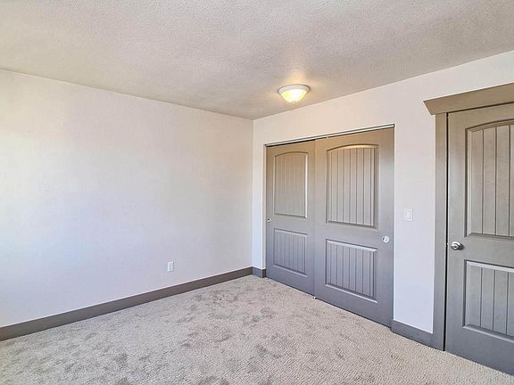 Carpeted bedroom #1 with double closet.