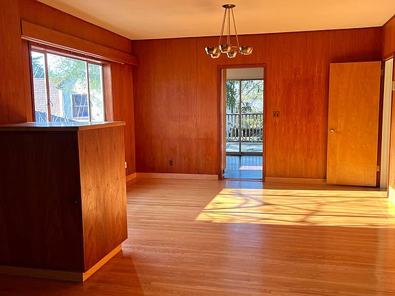 flowing living room and dining room - hardwood floors throughout house