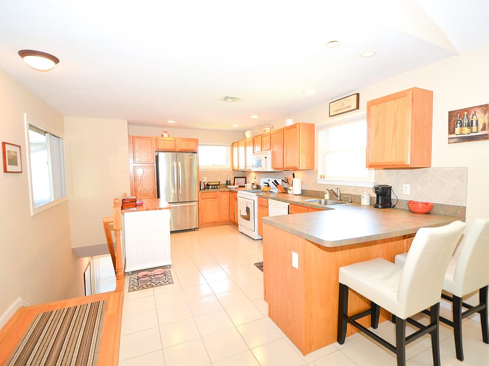 Open Concept Kitchen, corner unit flooded with light