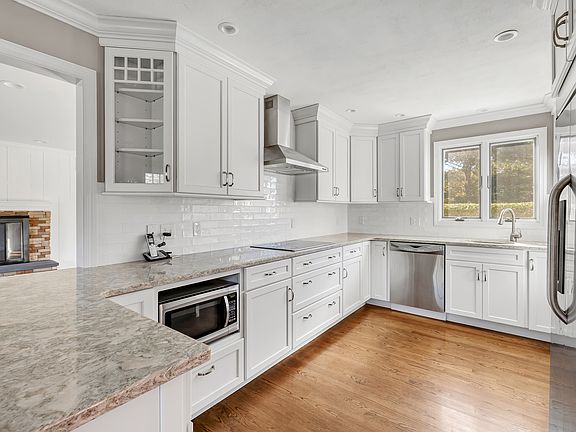 Spacious kitchen with electric cooktop.
