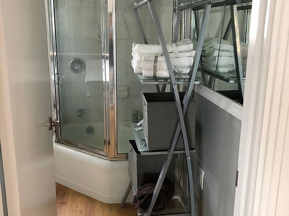 Bathroom with shower tub and large counter.