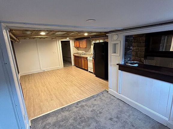 Entrance area, connecting to living room and open kitchen