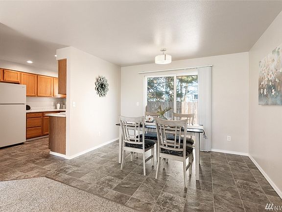 The gracious dining area easy caters to large or intimate gatherings, and is conveniently located just off the kitchen.
