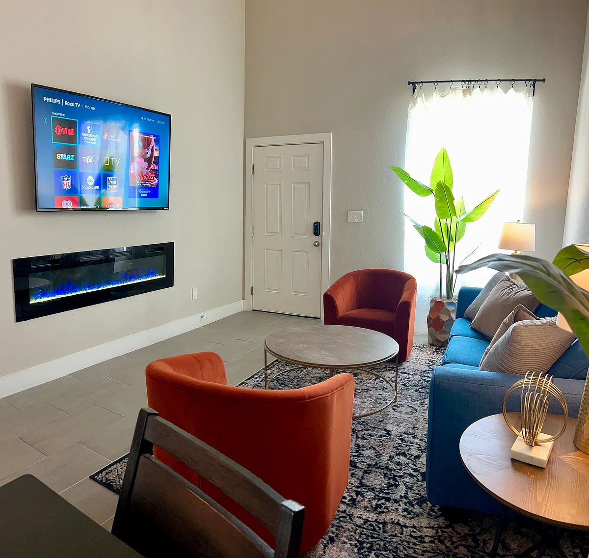 65" ROKU Smart TV in the living room, electric fireplace - 210 Rainbow Dr #3