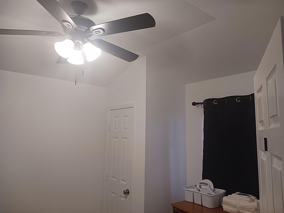 Reach-in closet, west-facing window with room-darkening curtains. Mini-fridge to stay cool.