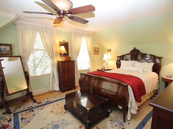 Queen bed made up with fresh linens.