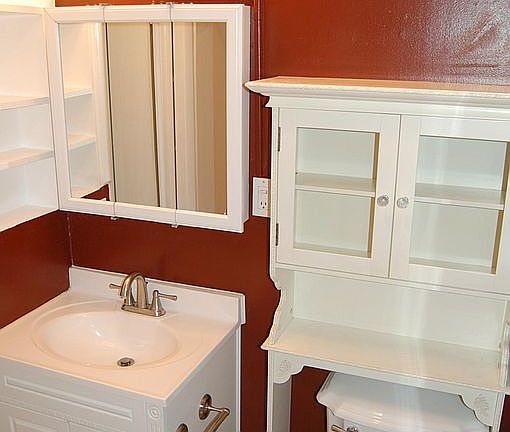 Bathroom vanity w brushed nickel finishes.