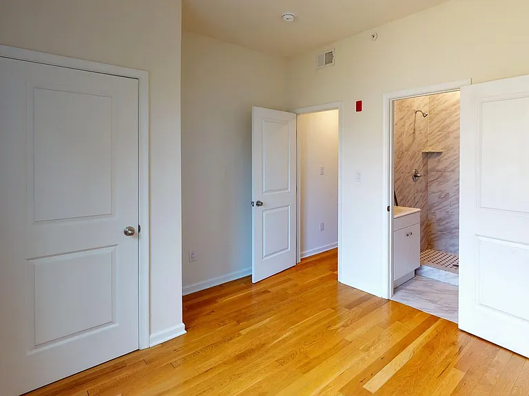 REAR BEDROOM WITH PRIVATE BATHROOM