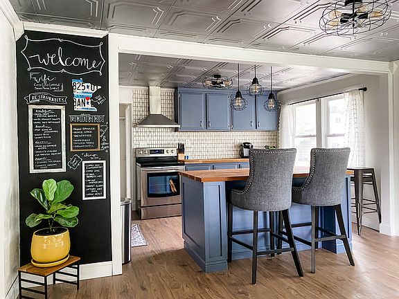 Open layout kitchen with custom butcher block island.
