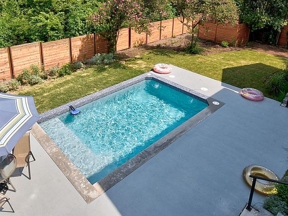Pool, patio, yard view from upstairs patio.