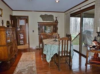 Formal dining room is just steps from the kitchen and has sliding glass doors out to the covered deck!  The room is also open to the living room.