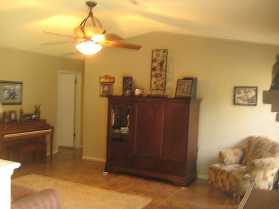 Spacious Living Room with vaulted ceiling and cute ceiling fan