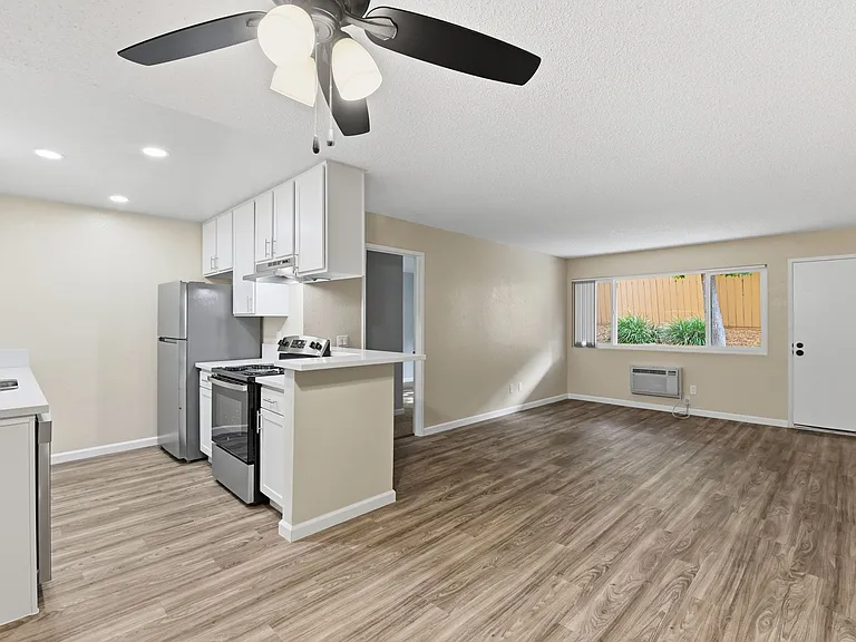 Our 'Premium' 2 Bedroom 2 Bath Apartment Kitchen & Living Room at Vista Flores Apartments