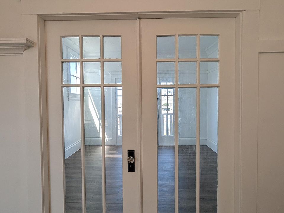 Double doors can be closed off to convert the living room into a second bedroom or home office.