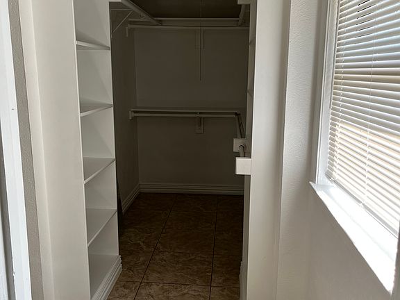 walk in closet of master bedroom