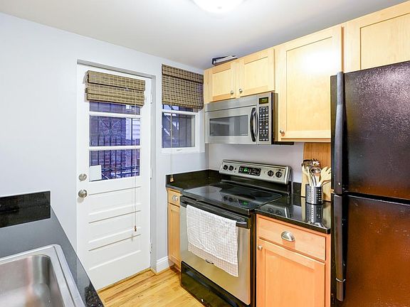 Granite and stainless steel kitchen with dishwasher