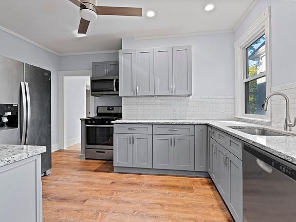 Brand new gray shaker all wood cabinets with soft close, stainless steel appliances, new waterproof flooring, LED ceiling lights and fan