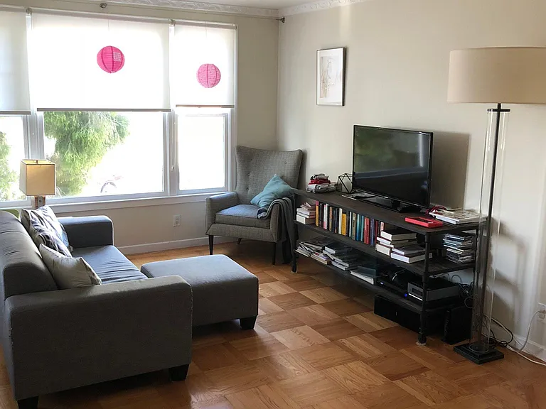living room with hardwood parquet flooring