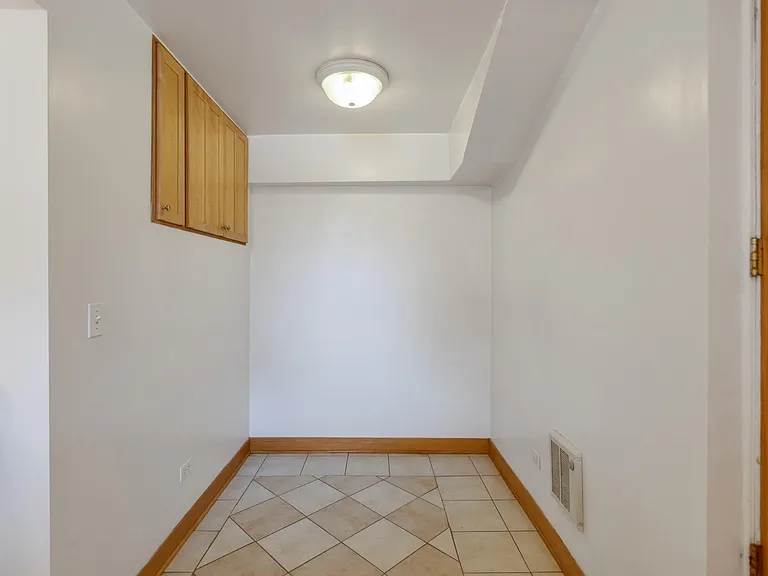 A Dining Alcove with Wine Cabinet and dish or barware storage.