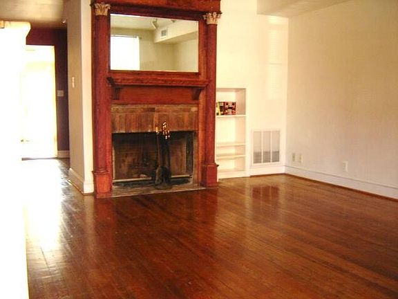 Spacious living room Heart pine floors, wood burning fireplace