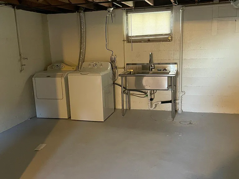 Basement laundry. New washer and utility sink