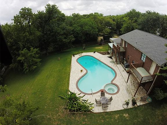 Great view of the pool at the back of the home, great for those hot Texas summers!