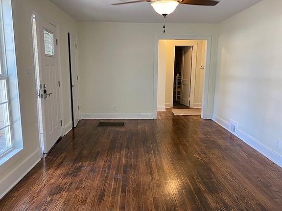 Living room with bedrooms and bathroom in front