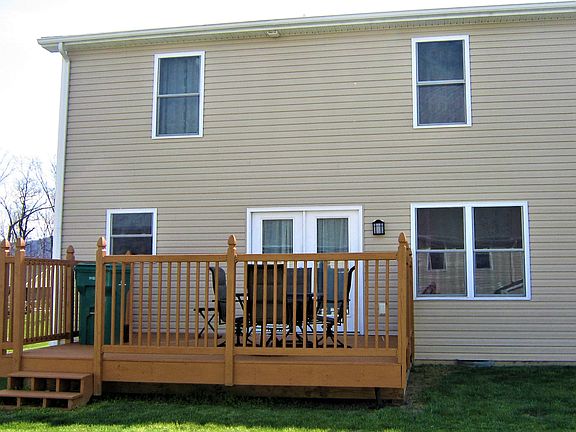 Back of house with deck
