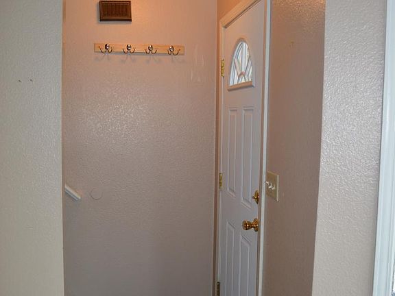 inside front door, coat rack
