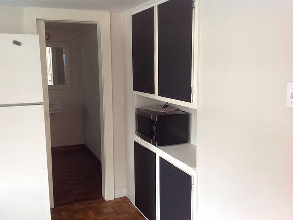 Microwave is included, chalkboard paint covers the cabinet d