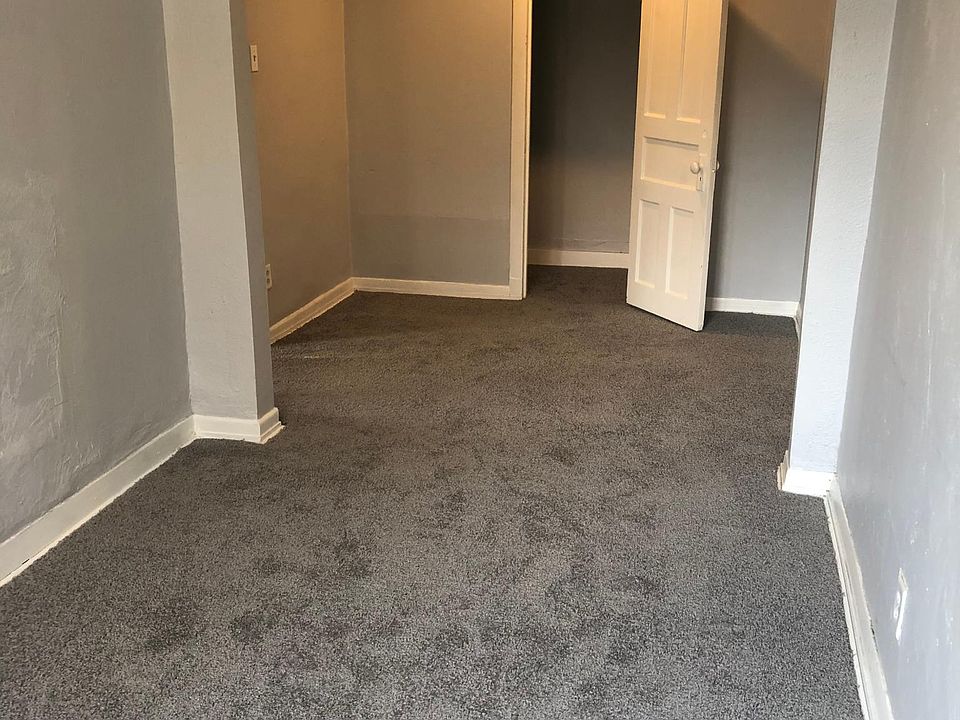 Living room looking into dining room and front closet.