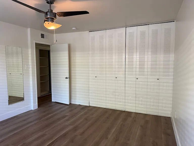 Bedroom facing towards closets