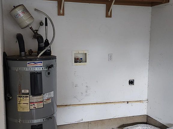 Water heater and Dryer and washer hookups in garage