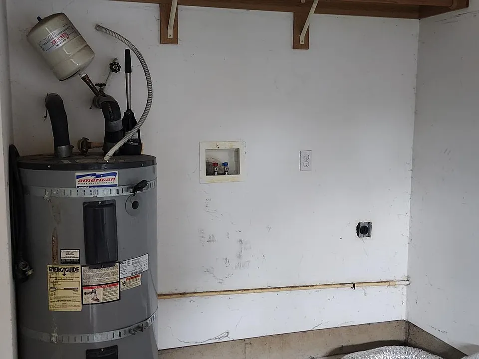 Water heater and Dryer and washer hookups in garage