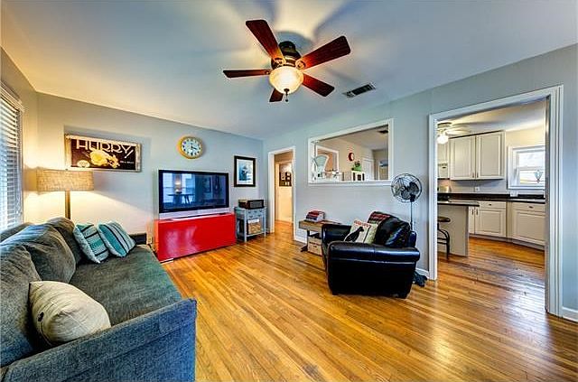 Light & bright living area open to the kitchen and dining nook.