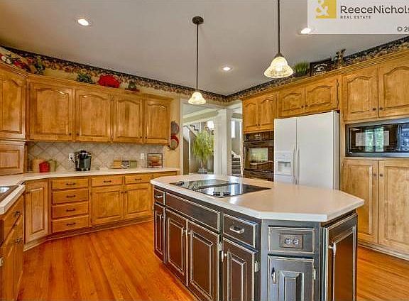 Custom Finished Island with Smooth Cook Top and Corian Counter.A